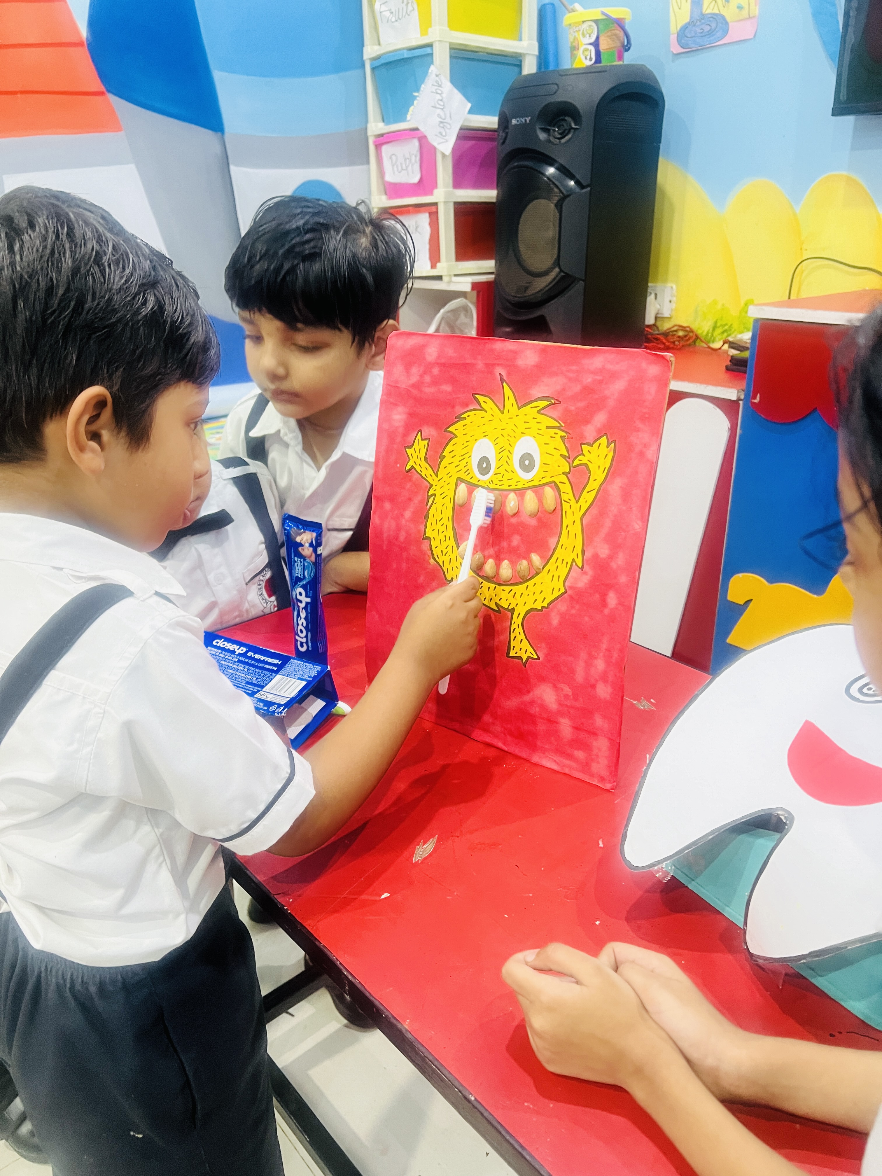 Dental Care Practice - Boy brushing teeth of a cartoon monster